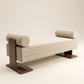 Supellex Home bench Lugano tapizado en tela bouclé color beige con dos rodillos laterales y base en madera nogal - vista en perspectiva tres cuartos