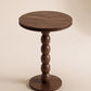 Supellex Home mesa auxiliar redonda Anaia en madera maciza de nogal con superficie circular y columna escultural de esferas torneadas - vista en perspectiva