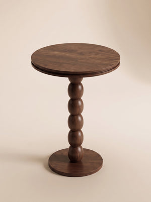 Supellex Home mesa auxiliar redonda Anaia en madera maciza de nogal con superficie circular y columna escultural de esferas torneadas - vista en perspectiva