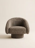 Supellex Home poltrona Taru tapizada en tela texturizada color gris topo con base redonda tapizada - vista frontal